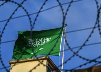 A Saudi Arabian flag flies behind barbed wires at the Saudi Arabian consulate in Istanbul on October 12, 2018. - Saudi Arabia's ambassador to Britain expressed concern about the fate of a journalist who vanished after entering its Istanbul consulate last week.But Prince Mohammed bin Nawaf al Saud told the BBC he needed to wait for the results of an investigation before commenting further about Jamal Khashoggi's fate. (Photo by OZAN KOSE / AFP)        (Photo credit should read OZAN KOSE/AFP via Getty Images)