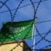 A Saudi Arabian flag flies behind barbed wires at the Saudi Arabian consulate in Istanbul on October 12, 2018. - Saudi Arabia's ambassador to Britain expressed concern about the fate of a journalist who vanished after entering its Istanbul consulate last week.But Prince Mohammed bin Nawaf al Saud told the BBC he needed to wait for the results of an investigation before commenting further about Jamal Khashoggi's fate. (Photo by OZAN KOSE / AFP)        (Photo credit should read OZAN KOSE/AFP via Getty Images)