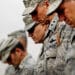 BAGHDAD, IRAQ - DECEMBER 15: U.S. military personnel bow their heads in prayer during a casing ceremony where the United States Forces- Iraq flag was retired signifying the departure of United States troops from Iraq at the former Sather Air Base on December 15, 2011 in Baghdad, Iraq. United States forces are scheduled to entirely depart Iraq by December 31, there are currently around 4,000 troops remaining in Iraq. (Photo by Mario Tama/Getty Images)