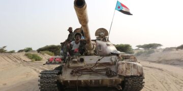 TOPSHOT - Fighters of the UAE-trained Security Belt Force, dominated by members of the the Southern Transitional Council (STC) which seeks independence for south Yemen, ride atop a tank in Yemen's southern coastal town of Shuqrah, east of the city of Aden, on August 27, 2019. - Saudi Arabia and the United Arab Emirates renewed a call earlier this week for peace talks between Yemen's government and southern separatists, urging a ceasefire following deadly clashes. (Photo by - / AFP) (Photo by -/AFP via Getty Images)