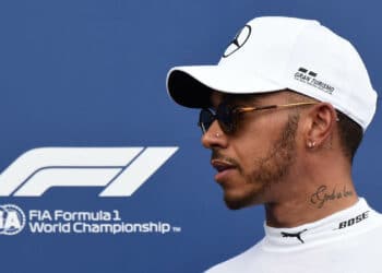 Mercedes' British driver Lewis Hamilton reacts on the podium after winning the pole position during the qualifying session at the Circuit Paul Ricard in Le Castellet, southern France, on June 23, 2018, ahead of the Formula One Grand Prix de France. (Photo by Boris HORVAT / AFP)        (Photo credit should read BORIS HORVAT/AFP via Getty Images)