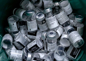 CORRECTION / Discarded vials of the Pfizer-BioNtech COVID-19 vaccine are seen at the Clalit Health Services in the Palestinian neighbourhood of Beit Hanina, in the Israeli-annexed east Jerusalem on March 2, 2021. (Photo by AHMAD GHARABLI / AFP) / The erroneous mention[s] appearing in the metadata of this photo by AHMAD GHARABLI has been modified in AFP systems in the following manner: [March 2] instead of [March 3]. Please immediately remove the erroneous mention from all your online services and delete it from your servers. If you have been authorized by AFP to distribute it to third parties, please ensure that the same actions are carried out by them. Failure to promptly comply with these instructions will entail liability on your part for any continued or post notification usage. Therefore we thank you very much for all your attention and prompt action. We are sorry for the inconvenience this notification may cause and remain at your disposal for any further information you may require. (Photo by AHMAD GHARABLI/AFP via Getty Images)