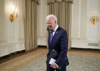 US President Joe Biden leaves after speaking about the March jobs report in the State Dining Room of the White House in Washington, DC, on April 2, 2021. - The US economy regained a massive 916,000 jobs in March, the biggest increase since August, with nearly a third of the increase in the hard-hit leisure and hospitality sector, the Labor Department reported on April 2, 2021. (Photo by MANDEL NGAN / AFP) (Photo by MANDEL NGAN/AFP via Getty Images)