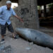 A Palestinian man reacts as he looks at an unexploded bomb dropped by an Israeli F-16 warplane on Gaza City's Rimal neighbourhood on May 18, 2021. - The UN Security Council was due to hold an emergency meeting today amid a flurry of urgent diplomacy aimed at stemming Israel air strikes that have killed more than 200 Palestinians. (Photo by Majdi Fathi/NurPhoto via Getty Images)