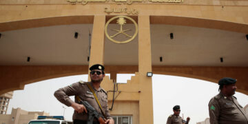 JAZAN, SAUDI ARABIA--APRIL 10, 2105--At the border crossing of the Saudi Arabia-Yemen border, near the town of Jazan, members of the Saudi Arabia Border Police stand guard as a few people cross the border in and out of Yemen. (Carolyn Cole/Los Angeles Times)