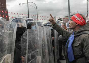 A Tunisian protester faces riot police during a demonstration held on the occasion of the 11th anniversary of the fall of late Tunisian president Zine El Abidine Ben Ali, under a heavy security forces deployment, on Habib Bourguiba avenue in Tunis, Tunisia, on January 14, 2022, to protest against President Kais Saied's power grab.
On July 25, 2021, Kais Saied dismissed the head of government and suspended the activities of parliament. Since September 22, 2021, Kais Saied rules by decrees and took exceptional measures for the exercise of legislative and executive powers. (Photo by Chedly Ben Ibrahim/NurPhoto)