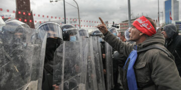 A Tunisian protester faces riot police during a demonstration held on the occasion of the 11th anniversary of the fall of late Tunisian president Zine El Abidine Ben Ali, under a heavy security forces deployment, on Habib Bourguiba avenue in Tunis, Tunisia, on January 14, 2022, to protest against President Kais Saied's power grab.
On July 25, 2021, Kais Saied dismissed the head of government and suspended the activities of parliament. Since September 22, 2021, Kais Saied rules by decrees and took exceptional measures for the exercise of legislative and executive powers. (Photo by Chedly Ben Ibrahim/NurPhoto)