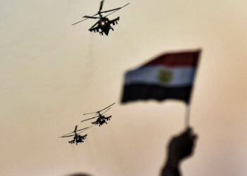 02 October 2020, Egypt, Cairo: Egyptian military helicopters fly over supporters of Egyptian President Abdel Fattah al-Sisi during a pro-government rally, held on the occasion the 6th of October war anniversary, near the Unknown Soldier Memorial. Photo: Sayed Hassan/dpa (Photo by Sayed Hassan/picture alliance via Getty Images)