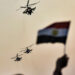 02 October 2020, Egypt, Cairo: Egyptian military helicopters fly over supporters of Egyptian President Abdel Fattah al-Sisi during a pro-government rally, held on the occasion the 6th of October war anniversary, near the Unknown Soldier Memorial. Photo: Sayed Hassan/dpa (Photo by Sayed Hassan/picture alliance via Getty Images)