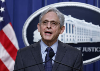 WASHINGTON, DC - APRIL 01: U.S. Attorney General Merrick Garland announces gun crime arrests and indictments during a news conference at the Robert F. Kennedy Department of Justices building on April 01, 2022 in Washington, DC. Joined by local and federal law enforcement officials, Garland announced that 12 people were indicted, including three U.S. Army soldiers from Fort Campbell, on federal firearms and money laundering charges in a scheme to move straw-purchased guns from Tennessee and Kentucky to the Gangster Disciples gang in Chicago. (Photo by Chip Somodevilla/Getty Images)