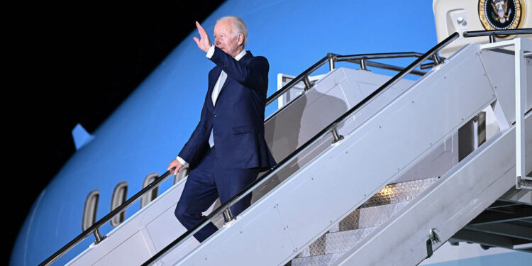 US President Joe Biden waves as he disembarks from Air Force One upon his arrival at the Franz Josef Strauss Airport in Munich, southern Germany on June 25, 2022, on the eve of the G7 summit. (Photo by Brendan SMIALOWSKI / AFP) (Photo by BRENDAN SMIALOWSKI/AFP via Getty Images)