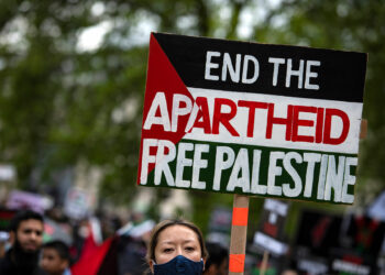LONDON, UNITED KINGDOM - 2021/05/22: A protester holds a placard during the demonstration.
Demonstrators came out in support of Palestinians and in opposition to recent Israeli bombardments of Palestinian territories resulting in tragic civilian casualties. The protesters denounced Israeli aggression and its regime of institutionalised  discrimination against the Palestinian people, amounting to apartheid. They called on the UK Government to implement sanctions against Israel, including a military embargo to cut the supply of arms, as well as imposing a ban on the import of goods from Israel's illegal settlements. (Photo by Loredana Sangiuliano/SOPA Images/LightRocket via Getty Images)
