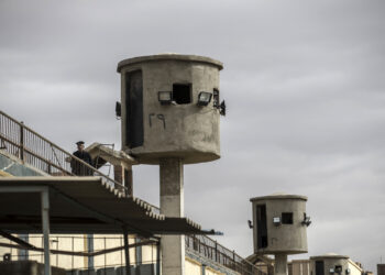 A picture taken during a guided tour organised by Egypt's State Information Service on February 11, 2020, shows an Egyptian policeman near watch towers at Tora prison on the southern outskirts of the Egyptian capital Cairo. (Photo by Khaled DESOUKI / AFP) (Photo by KHALED DESOUKI/AFP via Getty Images)