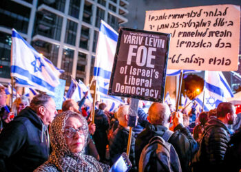TEL AVIV, ISRAEL - 2023/02/04: A protester holds a placard expressing her opinion on Israel's minister of Justice Yariv Levin, during the demonstration. Thousands of protesters rally for Democracy in Tel Aviv for the Fifth Consecutive Week across Israel. (Photo by Eyal Warshavsky/SOPA Images/LightRocket via Getty Images)