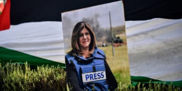 A portrait of slain Al Jazeera reporter Shireen Abu Akleh is pictured during a demonstration in front of the Israeli embassy to support Palestinians, in Athens on May 16, 2022. (Photo by Louisa GOULIAMAKI / AFP) (Photo by LOUISA GOULIAMAKI/AFP via Getty Images)