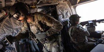 NORTHEASTERN SYRIA - MAY 26: U.S. Army CH-47 Chinook helicopter gunners scan the desert while transporting troops on May 26, 2021 over northeastern Syria. U.S. forces, part of Task Force WARCLUB operate from remote combat outposts in northeastern Syria, coordinating with the Syrian Democratic Forces (SDF) in combatting residual ISIS extremists and deterring pro-Iranian militia. (Photo by John Moore/Getty Images)