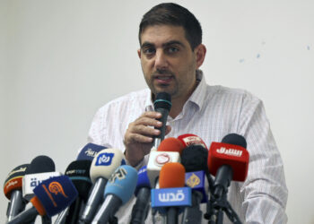 Ubai al-Aboudi, director of the Bisan Centre for Research and Development and user of one of six devices reportedly hacked with NSO Group's Pegasus spyware, speaks during a press conference at the offices of al-Haq Centre for Applied International Law in Ramallah in the occupied West Bank on November 8, 2021. - An investigation by a European rights group published on November 8 found that Israeli-made Pegasus spyware was used to hack the phones of staff of Palestinian civil society groups targeted by Israel. The revelations by Frontline Defenders -- confirmed by Amnesty International and the University of Toronto's Citizen Lab -- mark the latest development in the widening controversy surrounding six prominent Palestinian groups designated as "terrorist" organisations by Israel's defence ministry last month. (Photo by ABBAS MOMANI / AFP) (Photo by ABBAS MOMANI/AFP via Getty Images)