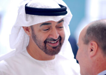 UNITED ARAB EMIRATES, ABU DHABI - JANUARY 17: Abu Dhabi Crown Prince Sheikh Mohammed Bin Zayed Al Nahyan speaking with an attendee during the 2012  World Future Energy Summit - Day Two held at the Abu Dhabi National Exhibition Centre on January 17, 2012 in Abu Dhabi, United Arab Emirates. The World Future Energy Summit annual four-day event draws major players in the renewable energy world and provides a showcase for the latest developments in clean energy technologies. (Photo by Sean Blake/Gallo Images/Getty Images)