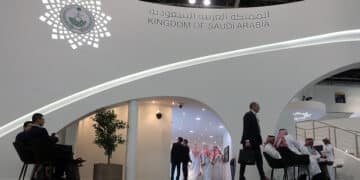 People stand next to the the Saudi pavilion (vision 2030) at the Gitex 2018 exhibition at the Dubai World Trade Center in Dubai on October 16, 2018 - Gitex ("Gulf Information Technology Exhibition") is a consumer computer and electronics trade show. (Photo by KARIM SAHIB / AFP)        (Photo credit should read KARIM SAHIB/AFP via Getty Images)