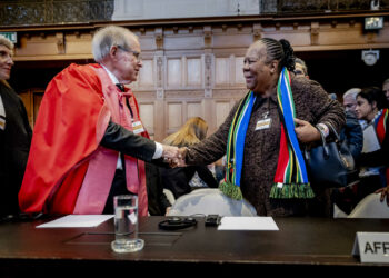 South African professor of International Law John Dugard and South African Minister of International Relations and Cooperation Naledi Pandor (R) arrive at the International Court of Justice (ICJ) prior to the verdict announcement in the genocide case against Israel, brought by South Africa, in The Hague on January 26, 2024. The top UN court said Israel should do everything it could to prevent any acts of genocide in the Gaza Strip, in a highly anticipated ruling. Israel must do everything to "prevent the commission of all acts within the scope" of the Genocide Convention, said the International Court of Justice on January 26, 2024. (Photo by Remko de Waal / ANP / AFP) / Netherlands OUT