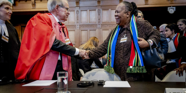 South African professor of International Law John Dugard and South African Minister of International Relations and Cooperation Naledi Pandor (R) arrive at the International Court of Justice (ICJ) prior to the verdict announcement in the genocide case against Israel, brought by South Africa, in The Hague on January 26, 2024. The top UN court said Israel should do everything it could to prevent any acts of genocide in the Gaza Strip, in a highly anticipated ruling. Israel must do everything to "prevent the commission of all acts within the scope" of the Genocide Convention, said the International Court of Justice on January 26, 2024. (Photo by Remko de Waal / ANP / AFP) / Netherlands OUT