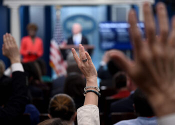 Members of the media raise their hands to ask questions as White House Press Secretary Karine Jean-Pierre and US Homeland Security Secretary Alejandro Mayorkas hold the daily press briefing in the James S Brady Press Briefing Room of the White House in Washington, DC, on May 11, 2023. Migrants entering the US without documents as pandemic-era controls lift May 11 face long-term bans and possible prosecution, Homeland Security Secretary Alejandro Mayorka warned. "Our borders are not open," Mayorkas said, hours before the US implements a tough new immigration policy. (Photo by Brendan SMIALOWSKI / AFP) (Photo by BRENDAN SMIALOWSKI/AFP via Getty Images)