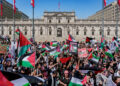 SANTIAGO, CHILE - OCTOBER 14: Hundreds of Palestinians residing in Chile together with supporters of the Palestinian cause gathered at a "Meeting for peace in Palestine" in the Plaza de La Constución outside the Palacio de La Moneda on October 14, 2023 in Santiago, Chile. Demonstrators demand that Israel put an end to its cycle of violence against the Palestinian people. Israel Prime Minister Benjamin Netanyahu on Monday gave orders for a "complete siege" of Gaza Strip as Israeli Defense Forces initiated air strikes in response to a surprise attack on Israel from the Palestinian militant group Hamas. (Photo by Sebastián Vivallo Oñate/Agencia Makro/Getty Images)