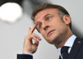 France's President Emmanuel Macron gestures ahead of the opening ceremony of the Paris 2024 Olympic Games in Paris on July 26, 2024. (Photo by Fabrice COFFRINI / AFP) (Photo by FABRICE COFFRINI/AFP via Getty Images)