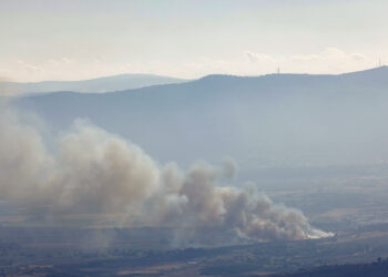 Smoke billows after a hit from a rocket fired from southern Lebanon over the Upper Galilee region in northern Israel on July 30, 2024, amid ongoing cross-border clashes between Israeli troops and Hezbollah fighters. Israeli medics on July 30 said one civilian, a 30-year-old man, was killed following a rocket attack on the northern kibbutz of HaGoshrim. The Israeli army meanwhile reported its forces were "striking the sources of fire" after the projectiles were fired from Lebanon. (Photo by Jalaa MAREY / AFP) (Photo by JALAA MAREY/AFP via Getty Images)