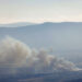 Smoke billows after a hit from a rocket fired from southern Lebanon over the Upper Galilee region in northern Israel on July 30, 2024, amid ongoing cross-border clashes between Israeli troops and Hezbollah fighters. Israeli medics on July 30 said one civilian, a 30-year-old man, was killed following a rocket attack on the northern kibbutz of HaGoshrim. The Israeli army meanwhile reported its forces were "striking the sources of fire" after the projectiles were fired from Lebanon. (Photo by Jalaa MAREY / AFP) (Photo by JALAA MAREY/AFP via Getty Images)