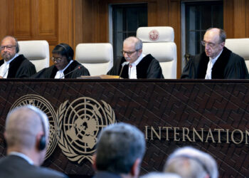 Judge and President of the International Court of Justice (ICJ), Nawaf Salam (2nd R) delivers a non-binding ruling on the legal consequences of the Israeli occupation of the West Bank and East Jerusalem at the International Court of Justice (ICJ) in The Hague on July 19, 2024. The UN's top court handed down its view, on July 19, 2024, declaring "illegal" Israel's occupation of Palestinian territories since 1967, amid growing international pressure over the war in Gaza. (Photo by Nick Gammon / AFP)