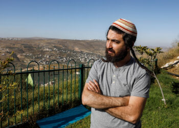 Tzvi Succot, the 29-year-old son of an ultra-Orthodox family, poses for a picture outside his home in the settlement of Yitzhar south of the Palestinian city of Nablus in the occupied West Bank, on June 22, 2020. - The 450,000 Israeli settlers in the occupied West Bank are a diverse group ranging from ultra-Orthodox to secular moderates, who hold varying views on Israel's impending decision on annexation. From July 1, the Israeli government aims to take first steps toward implementing part of a US-proposed Middle East peace plan that paves the way for annexing key parts of the West Bank, including settlements long considered illegal by the majority of the international community. (Photo by MENAHEM KAHANA / AFP) (Photo by MENAHEM KAHANA/AFP via Getty Images)