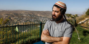 Tzvi Succot, the 29-year-old son of an ultra-Orthodox family, poses for a picture outside his home in the settlement of Yitzhar south of the Palestinian city of Nablus in the occupied West Bank, on June 22, 2020. - The 450,000 Israeli settlers in the occupied West Bank are a diverse group ranging from ultra-Orthodox to secular moderates, who hold varying views on Israel's impending decision on annexation. From July 1, the Israeli government aims to take first steps toward implementing part of a US-proposed Middle East peace plan that paves the way for annexing key parts of the West Bank, including settlements long considered illegal by the majority of the international community. (Photo by MENAHEM KAHANA / AFP) (Photo by MENAHEM KAHANA/AFP via Getty Images)