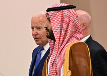 US President Joe Biden (behind) and Saudi Crown Prince Mohammed bin Salman (front) arrive for the family photo during the Jeddah Security and Development Summit (GCC+3) at a hotel in Saudi Arabia's Red Sea coastal city of Jeddah on July 16, 2022. (Photo by MANDEL NGAN / POOL / AFP) (Photo by MANDEL NGAN/POOL/AFP via Getty Images)