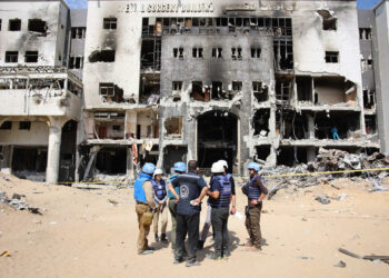 A United Nations (UN) team inspects the grounds of Al-Shifa hospital, Gaza's largest hospital, which was reduced to ashes by a two-week Israeli raid, on April 8, 2024, amid the ongoing conflict between Israel and the Palestinian Hamas militant group. (Photo by AFP)