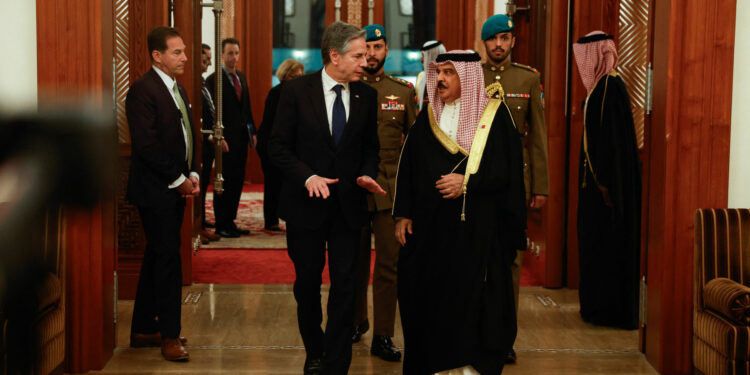 US Secretary of State Antony Blinken (L) walks with Bahrain's King Hamad bin Isa bin Salman al-Khalifa at the start of their meeting in Manama, on the latest leg of his week-long trip across the Middle East on January 10, 2024. Blinken arrived in the Gulf state of Bahrain, home base of the US Fifth Fleet, for talks with King Hamad on preventing a regional escalation of the war between Israel and Hamas militants in Gaza, the State Department said. (Photo by EVELYN HOCKSTEIN / POOL / AFP)