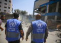 GAZA CITY, GAZA - JULY 15: UNRWA employees and Palestinians inspect a damaged school after Israeli fighter jets hit United Nations Relief and Works Agency for Palestine Refugees in the Near East (UNRWA) school, killing and injuring many in Nuseirat Refugee Camp of Deir al-Balah, Gaza on July 15, 2024. (Photo by Ashraf Amra/Anadolu via Getty Images)