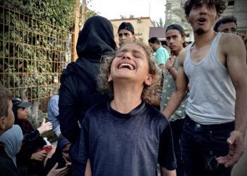 KHAN YUNIS, GAZA - OCTOBER 9: A Palestinian girl cries, as they try to live under hard conditions amid Israeli attacks and restrictions during the ''International Day of the Girl Child', in Khan Yunis, Gaza on October 9, 2024. "International Day of the Girl Child" is celebrated on October 11 every year to draw attention to the problems faced by girls such as discrimination, violence, cultural and economic barriers and inequality, who are also deprived from their basic rights all around the world. The situation of girls in Gaza, who grew up amidst the sounds of guns and bombs and the bitter face of war due to Israeli attacks and the embargo enforcement continues in Gaza. (Photo by Doaa Albaz/Anadolu via Getty Images)