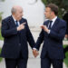 France's President Emmanuel Macron (R) and Algeria's President Abdelmadjid Tebboune (L) gesture towards each other as they attend the G7 Summit hosted by Italy at the Borgo Egnazia resort in Apulia region, in Savelletri on June 13, 2024. Leaders of the G7 wealthy nations gather in southern Italy this week against the backdrop of global and political turmoil, with boosting support for Ukraine top of the agenda. (Photo by Ludovic MARIN / AFP)