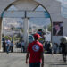 Syrian Red Crescent rescuers attend to displaced people arriving from Lebanon at the Jdeidat Yabus border crossing in southwestern Syria on October 7, 2024. The head of the UN refugee agency warned on October 6 that civilians in Lebanon were caught in the crossfire as Israel's intensified bombardment campaign forced many to flee while others were trapped under fire. (Photo by LOUAI BESHARA / AFP)