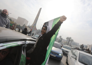 DAMASCUS, SYRIA - DECEMBER 08: Syrians celebrate the collapse of 61 years of Baath Party rule in Damascus, Syria on December 08, 2024. Sixty-one years of Baath Party rule in Syria collapsed on Sunday when, the capital fell out of the hands of regime control. As anti-regime armed groups started to dominate the capital, the Assad regime on Sunday morning quickly lost all control of Damascus. (Photo by Bekir Kasim/Anadolu via Getty Images)