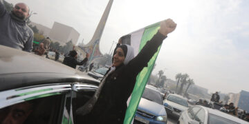 DAMASCUS, SYRIA - DECEMBER 08: Syrians celebrate the collapse of 61 years of Baath Party rule in Damascus, Syria on December 08, 2024. Sixty-one years of Baath Party rule in Syria collapsed on Sunday when, the capital fell out of the hands of regime control. As anti-regime armed groups started to dominate the capital, the Assad regime on Sunday morning quickly lost all control of Damascus. (Photo by Bekir Kasim/Anadolu via Getty Images)