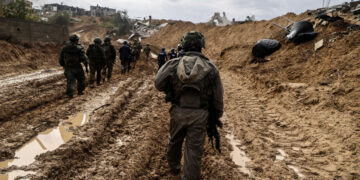 --PHOTO TAKEN DURING A CONTROLLED TOUR AND SUBSEQUENTLY EDITED UNDER THE SUPERVISION OF THE ISRAELI MILITARY-- This picture taken during a media tour organised by the Israeli military on January 27, 2024, shows Israeli soldiers patrolling an area in Gaza's main southern city of Khan Yunis, amid continuing battles between Israel and the Palestinian militant group Hamas. (Photo by Nicolas GARCIA / AFP)