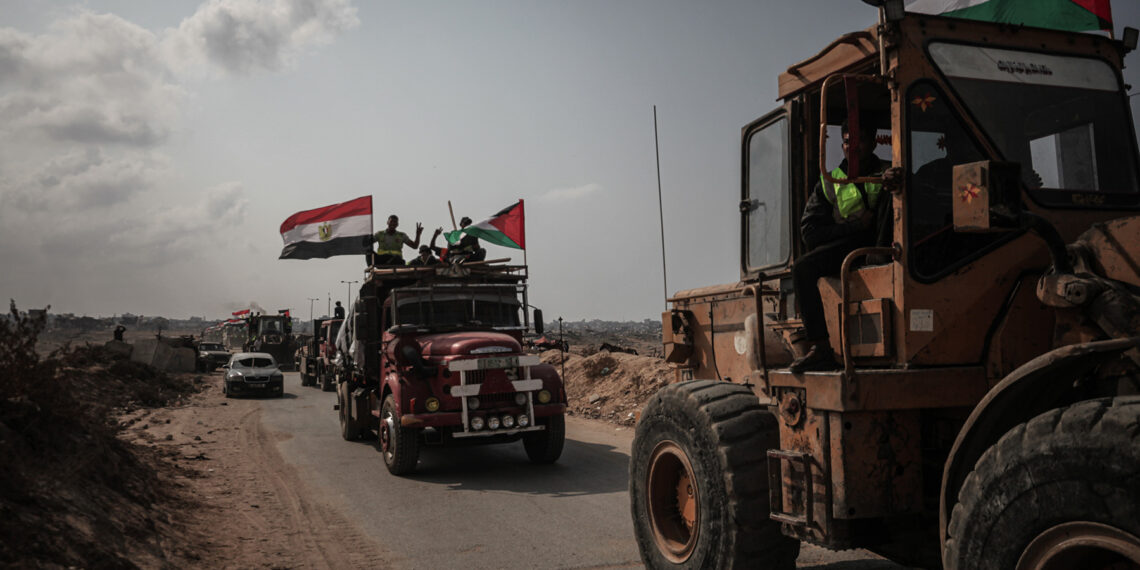 GAZA CITY, GAZA - NOVEMBER 11: Dozens of heavy construction vehicles belonging to the Egyptian delegation arrive in the Netzarim area in central Gaza to begin infrastructure work for a new tent camp for displaced Palestinians on November 11, 2025. The teams continue efforts to provide shelter amid widespread destruction and dire humanitarian conditions. (Photo by Moiz Salhi/Anadolu via Getty Images)