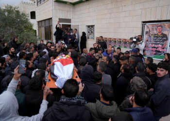 MUKHMAS, WEST BANK - FEBRUARY 19: Palestinians attend the funeral of Nasrullah Mohammed Jamal Abu Siyam, who was killed after Israeli settlers opened fire during a raid on the town of Mukhmas, northeast of East Jerusalem, on February 19, 2026. (Photo by Issam Rimawi/Anadolu via Getty Images)