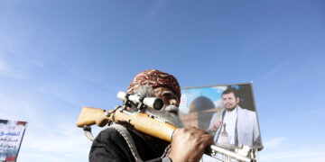 SANAA, YEMEN - MARCH 27: People gather to stage a protest against U.S. and Israeli attacks against Iran, at Sabeen Square in Sanaa, Yemen on March 27, 2026. (Photo by Mohammed Hamoud/Anadolu via Getty Images)