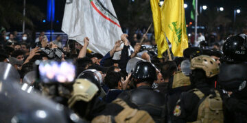 BASRA, IRAQ - APRIL 7: A group of Iraqi protesters storms the Kuwaiti Consulate and removes the Kuwaiti national flag from the building in Basra, Iraq on April 7, 2026. Iraqi security forces intervened by using tear gas to disperse the demonstrators who breached the diplomatic compound following an alleged air strike in the nearby Hor Zubayr region. (Photo by Haidar Mohammed Ali/Anadolu via Getty Images)